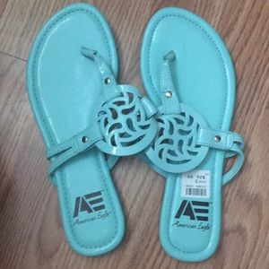 Blue American Eagle sandals.